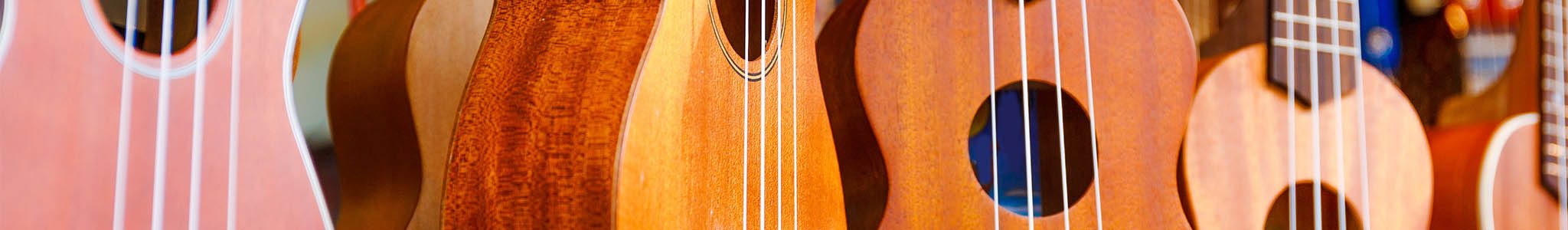 Headers-Small-2048x300_0000_iStock-506466583 Ukulele hanging on the wall