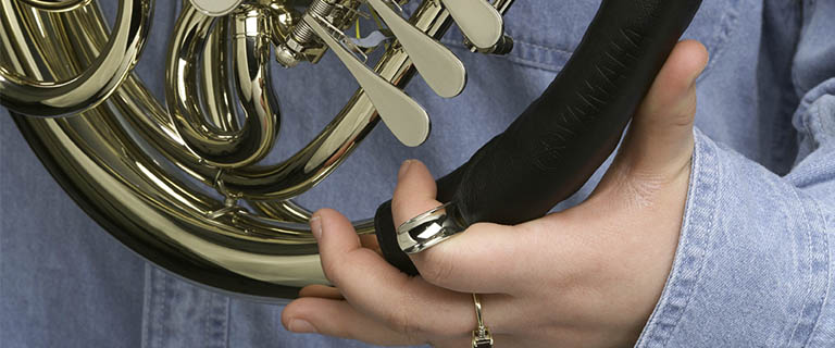 Instrument Accessories student holding french horn