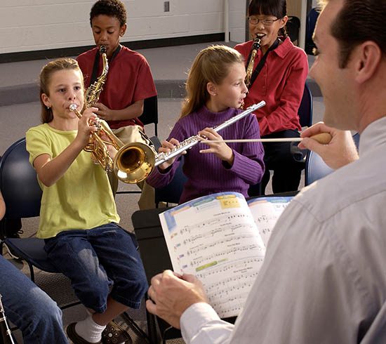 Photos-550X490-foundation Students in band working with director