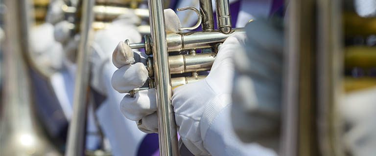 Trumpets being held during a parade