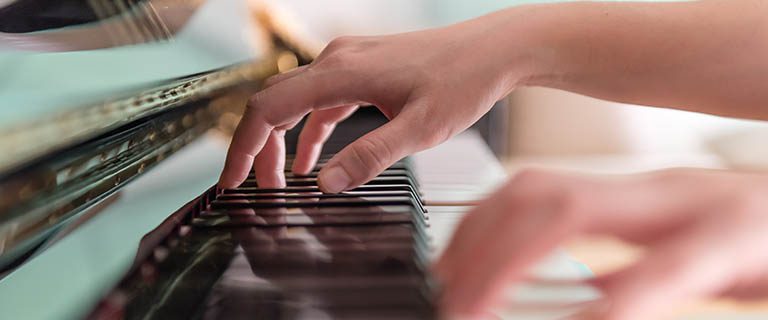 Buy an Instrument Student playing the piano